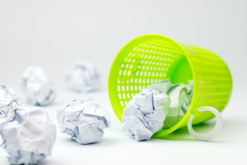 wastebasket and crumpled paper illustrating the idea that yes, you can edit your life when writing a memoir