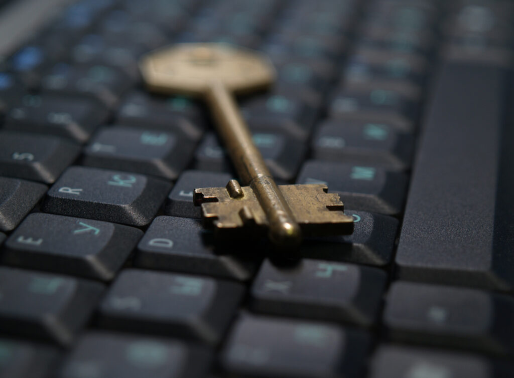 key on keyboard illustrating the idea that there are keys to knowing whether you want to hire a ghostwriter for your book