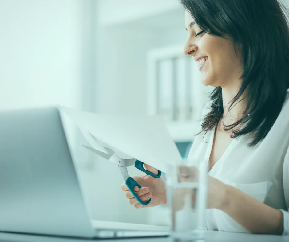 image of woman cutting a document illustrating best editing tools